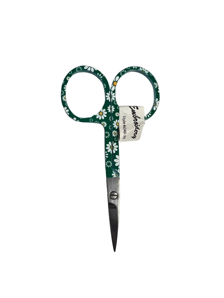 Green embroidery scissors with floral pattern on a white background