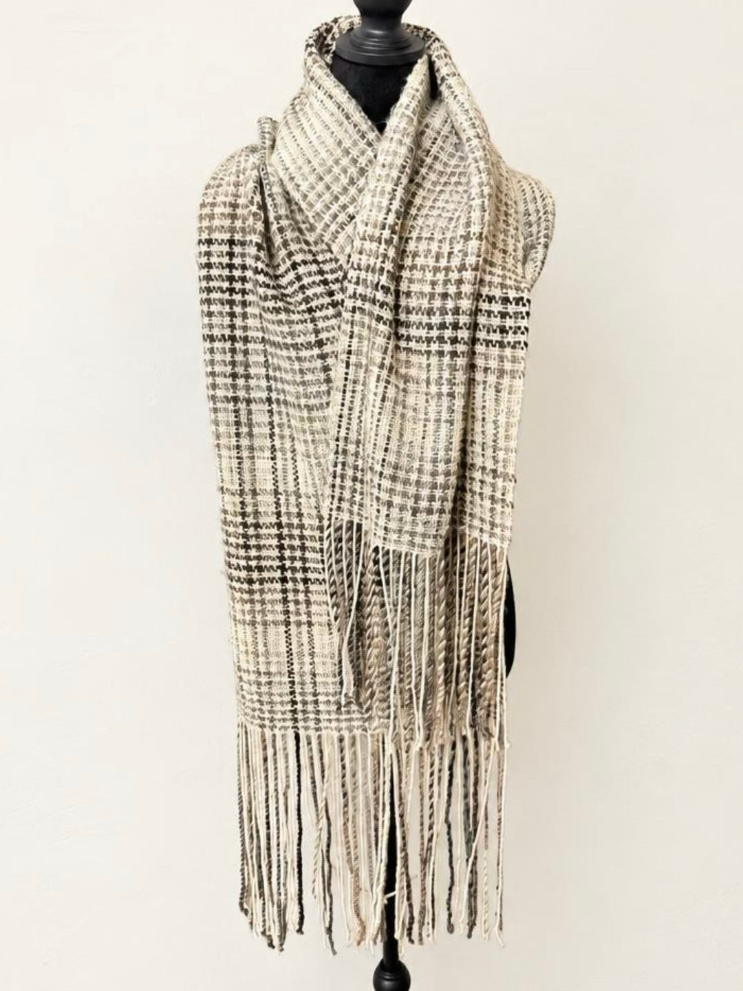 Handwoven Color Striping Houndstooth Wrap in cream sparkle and brown self-striping yarn with twisted fringe, shown on a dress form