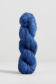 Blue skein of yarn on a white background