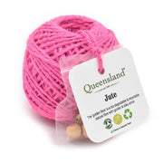 Pink jute ball with a Queensland brand label on a white background