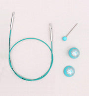 Strong and flexible - made of finest grade material.  Smooth coated and teal in color.  Allows your interchangeable tips to swivel freely.  Memory free cord for no twisting.  Marked at 1" intervals for convenient measuring.  Offered with teal colored end caps with the floral print are a delight to use and the cord keys used for tightening the tips to the cord come with a color coordinated top.  The Mindful Collection Smart Cords will work with all Knitter's Pride needles.  Comes with 1 cord key & 2 end caps