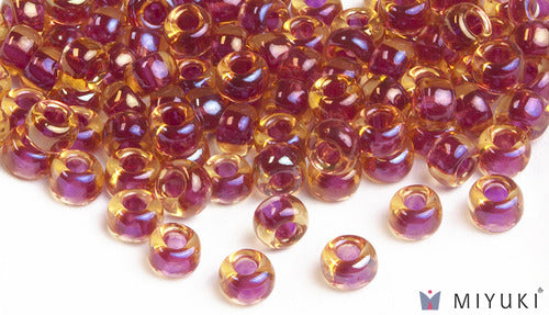 Cranberry-lined Topaz AB 6/0 Glass Beads